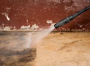 Pressure washing a concrete driveway